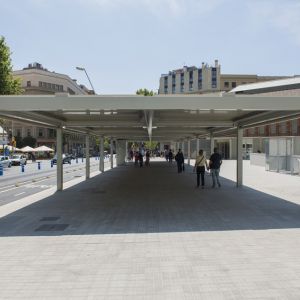People walking under the pergolas of lamas in the Sant Antoni Market